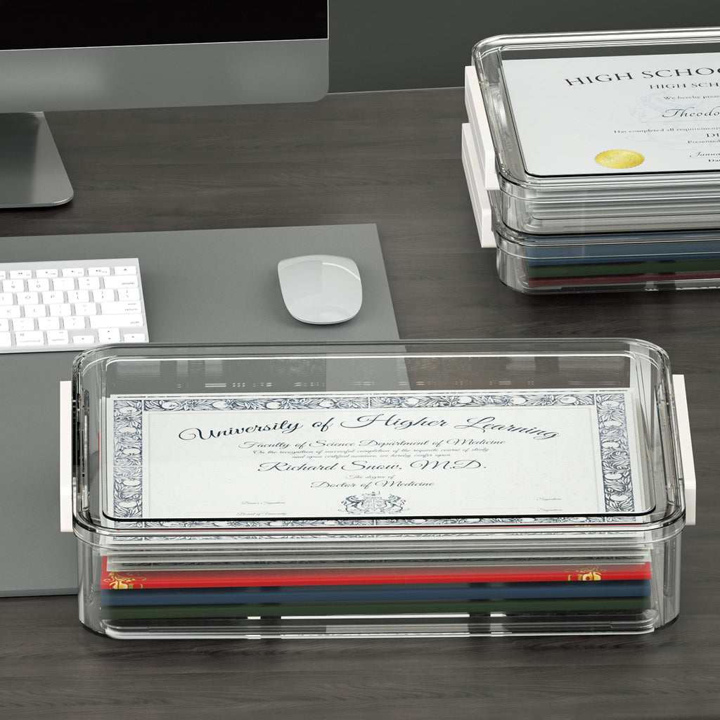 Clear storage box holding certificates and documents on an office desk