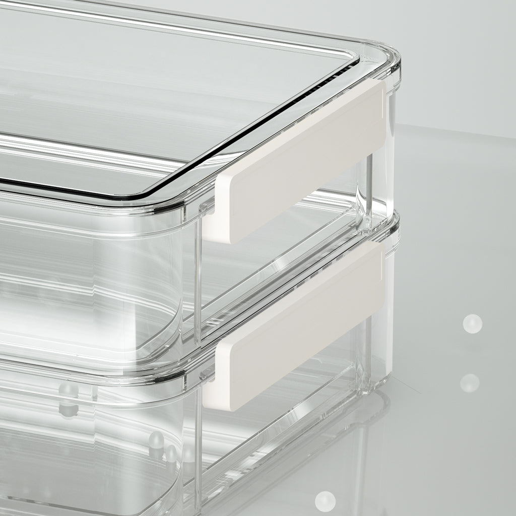 Close-up of white side latches and lids on two stacked clear storage boxes