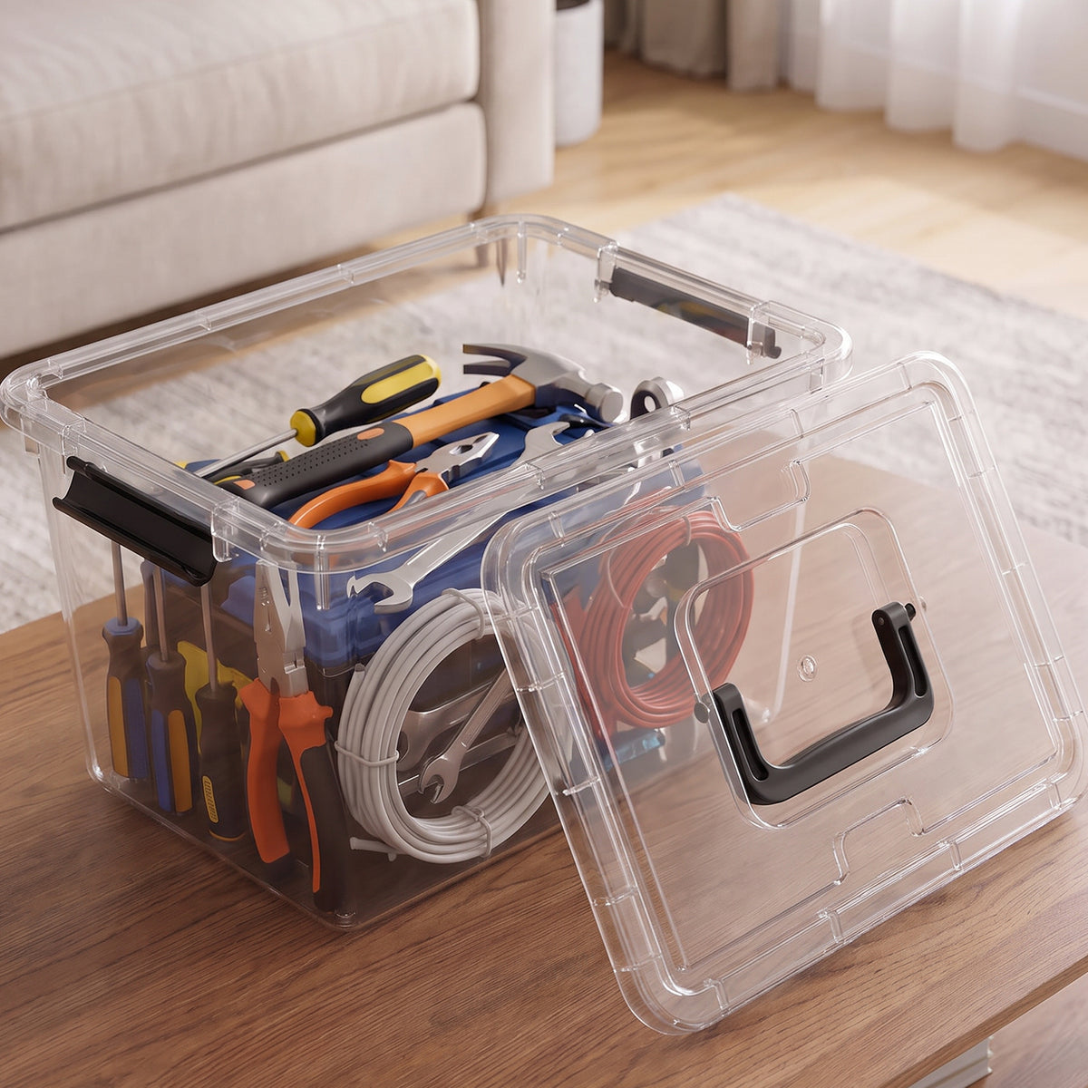 Clear lidded storage box organizing tools and cables
